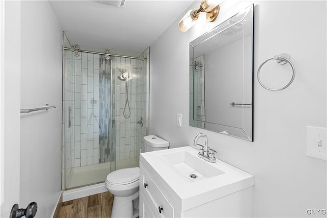 9869 Hazard Rd, Marcy, NY 13403 - full bathroom with toilet, a shower stall, wood finished floors, and vanity