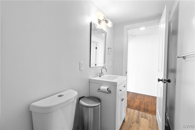 9869 Hazard Rd, Marcy, NY 13403 - half bath with toilet, wood finished floors, and vanity