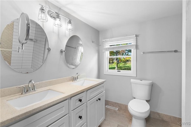 9869 Hazard Rd, Marcy, NY 13403 - bathroom featuring toilet, baseboards, double vanity, and tile patterned floors