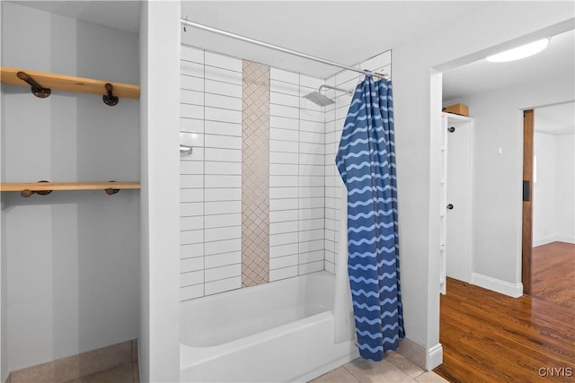 9869 Hazard Rd, Marcy, NY 13403 - full bath featuring shower / tub combo, baseboards, and wood finished floors