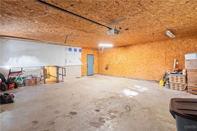 9869 Hazard Rd, Marcy, NY 13403 - garage featuring a garage door opener