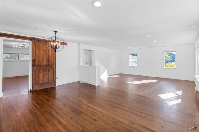 9869 Hazard Rd, Marcy, NY 13403 - unfurnished living room with dark wood-style floors, a barn door, baseboards, recessed lighting, and a chandelier