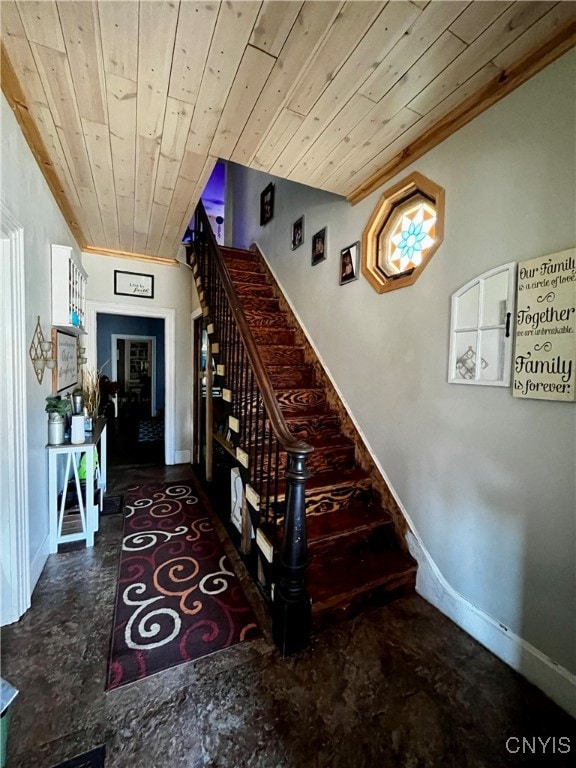 stairway featuring wood ceiling