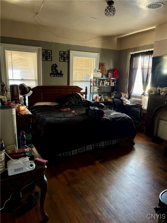 bedroom with wood-type flooring