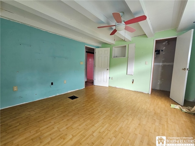 unfurnished bedroom with beam ceiling, light hardwood / wood-style floors, and ceiling fan