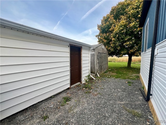 exterior space with a storage shed