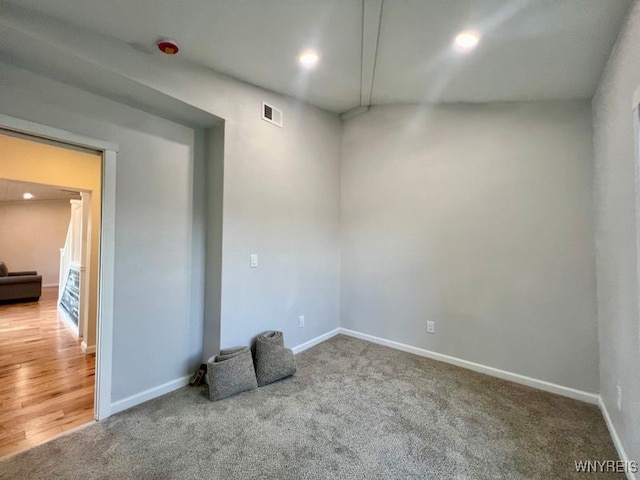 spare room featuring wood-type flooring