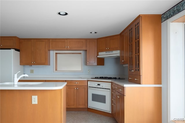 kitchen featuring sink and white appliances