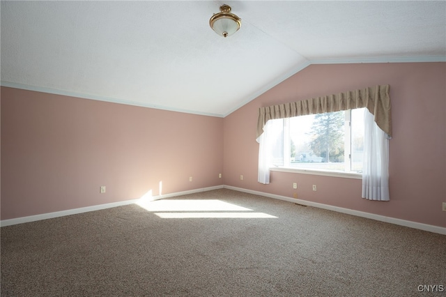 additional living space featuring carpet and lofted ceiling