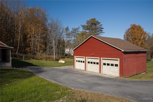 garage with a yard