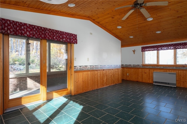 unfurnished room with wood ceiling, ceiling fan, plenty of natural light, and vaulted ceiling