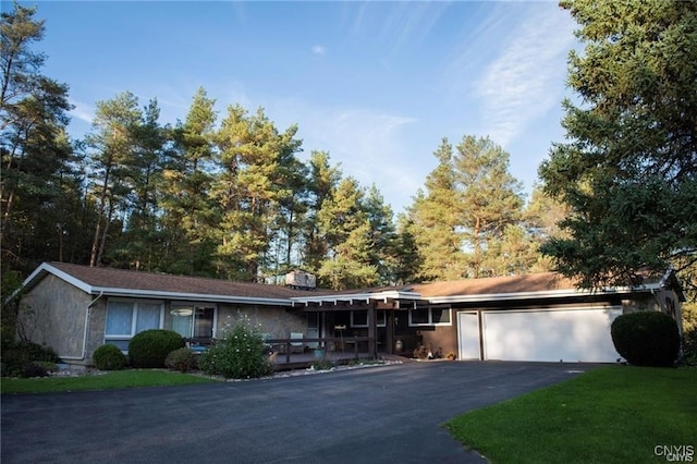 single story home with a garage