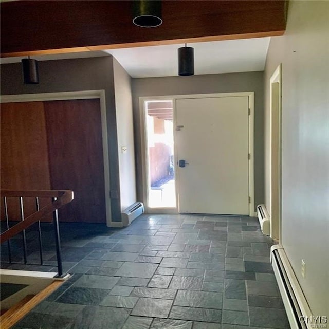 entryway featuring baseboard heating and beam ceiling