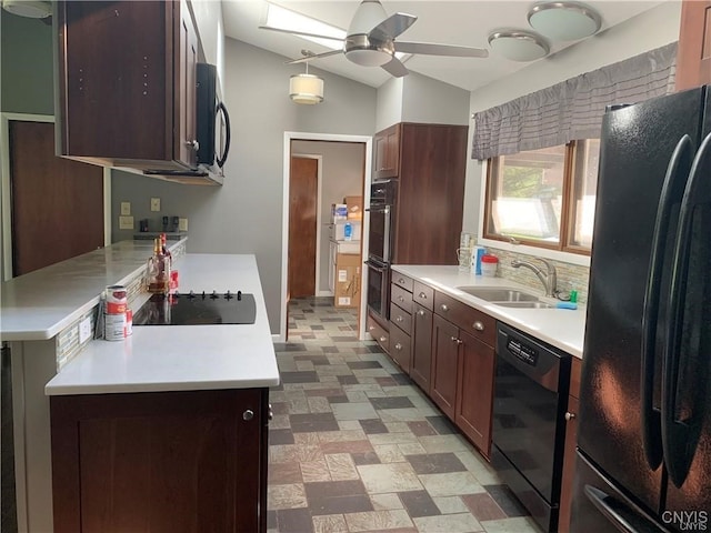 kitchen featuring lofted ceiling, sink, black appliances, dark brown cabinetry, and ceiling fan