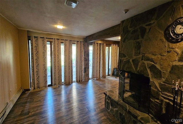 living room with a baseboard radiator, crown molding, a healthy amount of sunlight, and dark hardwood / wood-style flooring