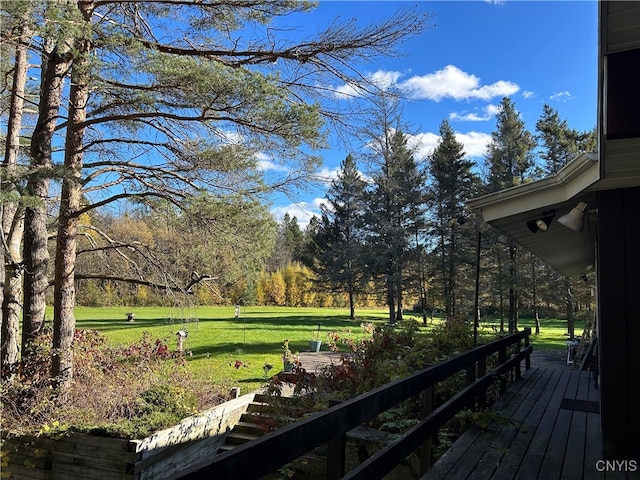 deck featuring a yard