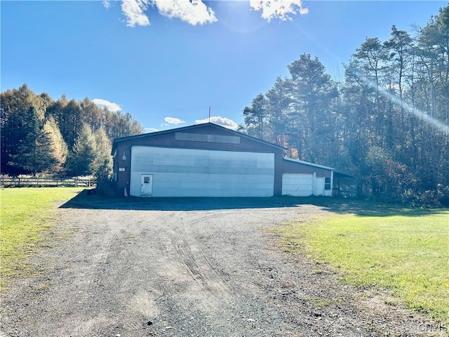 garage with a yard