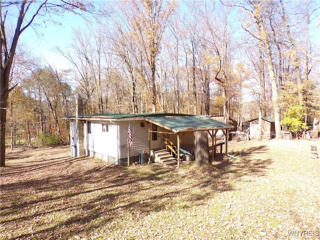 exterior space with a front lawn and a shed