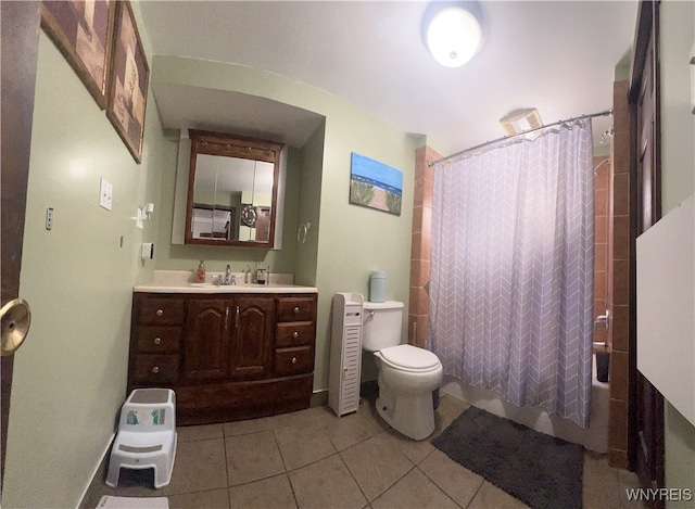 full bathroom with vanity, toilet, shower / tub combo, and tile patterned flooring