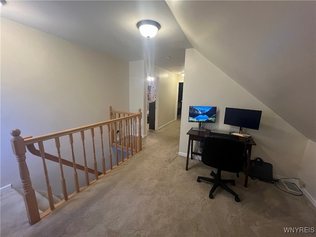 office area with lofted ceiling and carpet floors