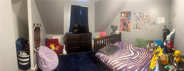 bedroom featuring lofted ceiling