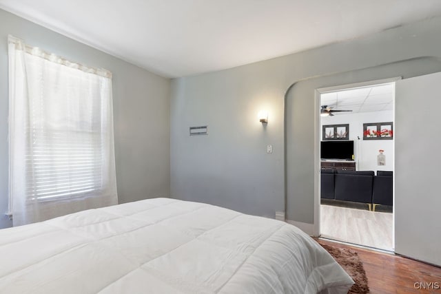 bedroom with hardwood / wood-style floors