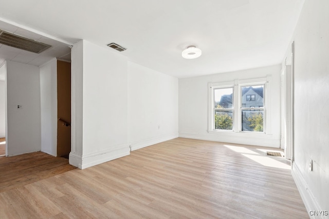 unfurnished room featuring light hardwood / wood-style floors