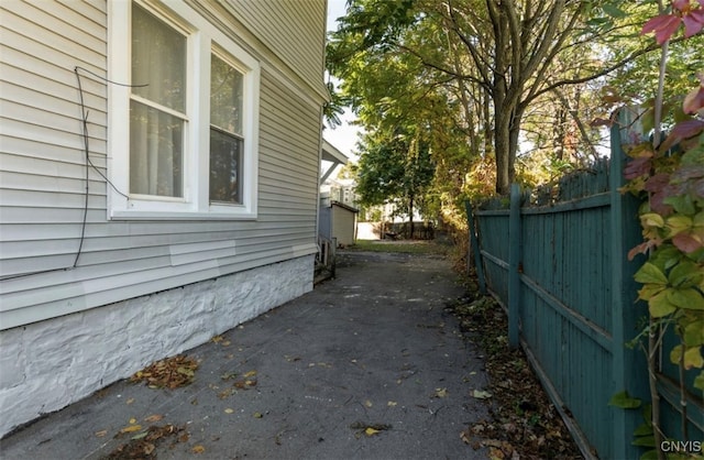 view of side of property with a patio area