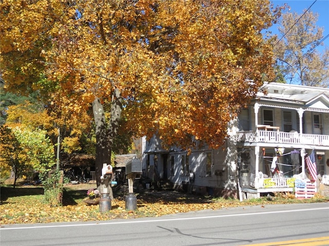 obstructed view of property with covered porch