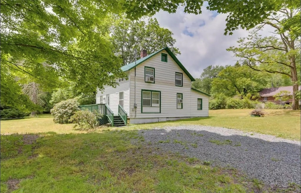 view of home's exterior featuring a lawn