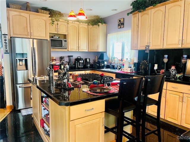 kitchen featuring stainless steel appliances, sink, and light brown cabinets