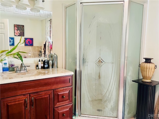 bathroom with vanity and an enclosed shower