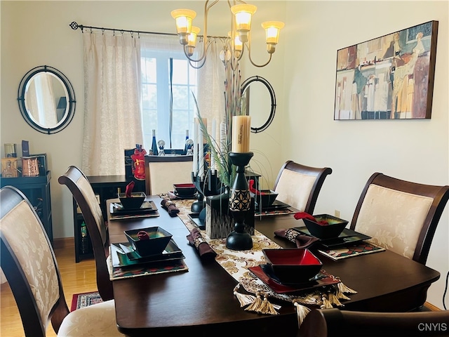 dining room with a notable chandelier and hardwood / wood-style flooring