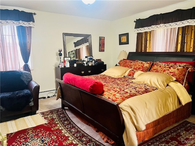 carpeted bedroom with a baseboard heating unit