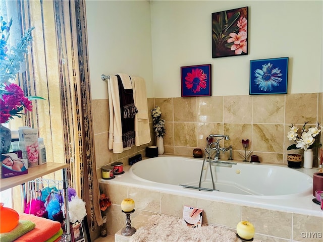 bathroom featuring tiled tub