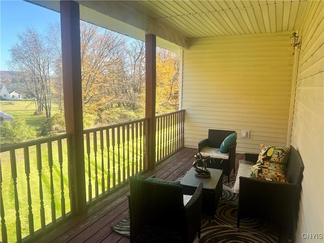 wooden deck featuring outdoor lounge area