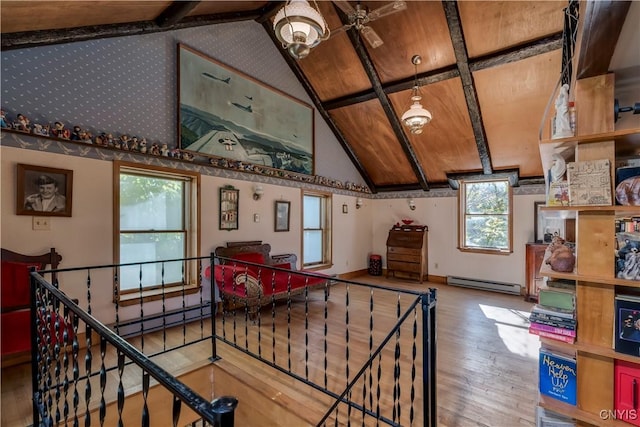 recreation room with high vaulted ceiling, a baseboard radiator, a baseboard heating unit, and wood finished floors