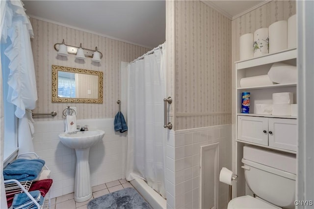 full bathroom with ornamental molding, tile patterned floors, wainscoting, and wallpapered walls