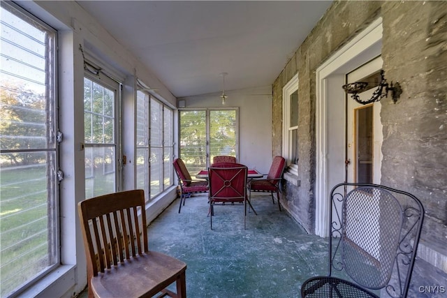 sunroom / solarium with vaulted ceiling