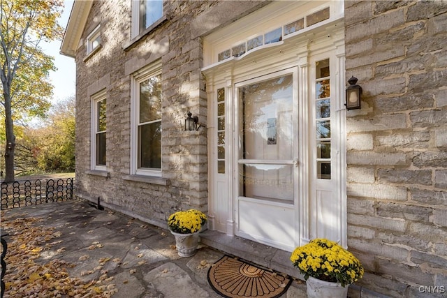 view of exterior entry with stone siding