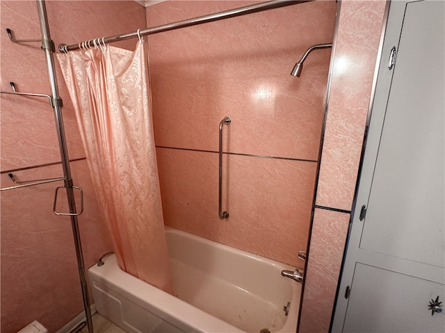 bathroom featuring shower / bath combo with shower curtain