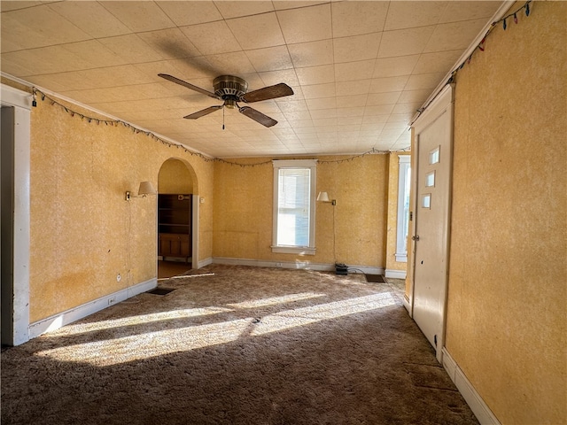 carpeted empty room with ceiling fan