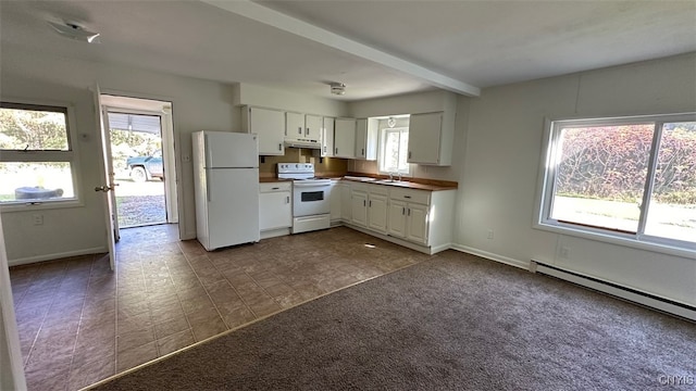 kitchen featuring white appliances, carpet, a wealth of natural light, and white cabinets