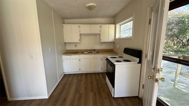 kitchen featuring sink, white cabinetry, dark wood-type flooring, and white electric stove