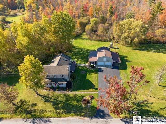 drone / aerial view featuring a forest view