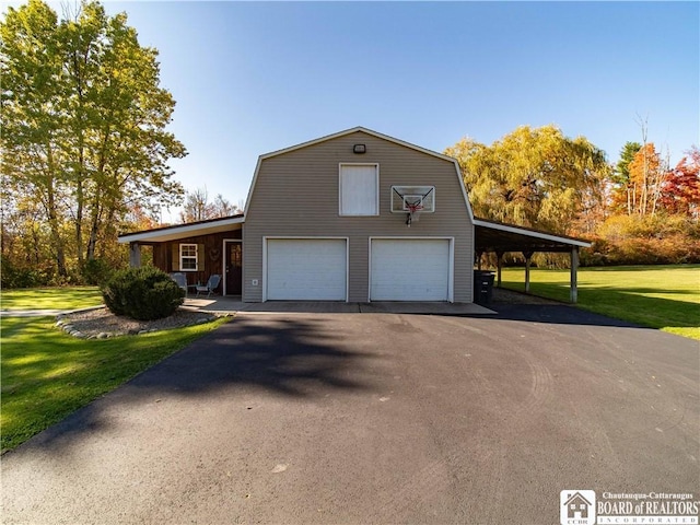 view of home's exterior with a carport, a garage, and a lawn