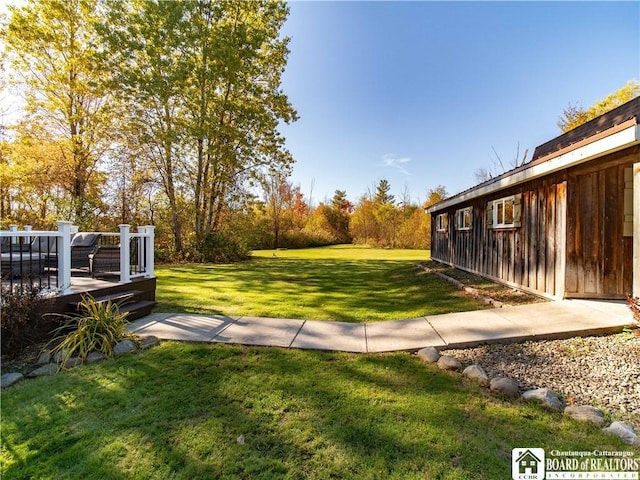 view of yard featuring a wooden deck