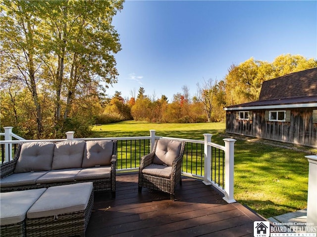 wooden terrace with an outdoor living space and a lawn