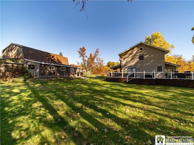 view of yard with a wooden deck