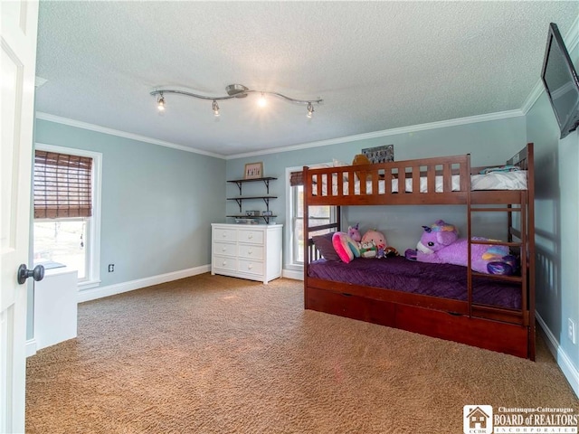 bedroom with baseboards, a textured ceiling, carpet, and ornamental molding